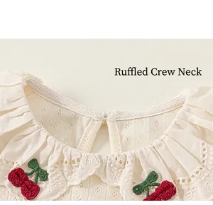 Close-up of girls cotton t-shirt with delicate lace collar and cherry embroidery