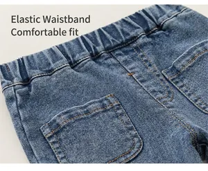 Close-up detail showing the comfortable elastic waistband on children's blue denim flare pants