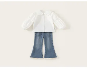 Detail view of girls two-piece set with white Peter Pan collar shirt and flared denim jeans