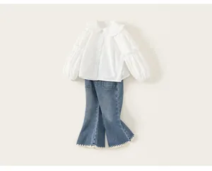 Two-piece casual set for girls featuring white ruffle-collar shirt and denim flare pants.