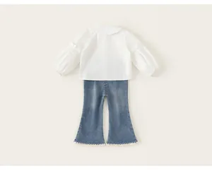 Back view of girl's 2-piece clothing set with a ruffled white shirt and denim flares.