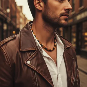 Men's bohemian wood bead necklace shown on a model in a casual street style outfit.
