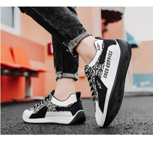 Detailed side view showing the stylish black and white pattern of designer canvas sneakers