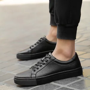 Men's black leather low-top casual sneakers with breathable perforated upper
