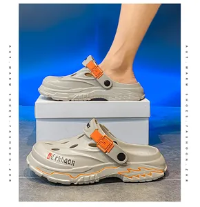 Close-up of breathable men's outdoor beige clogs with adjustable orange straps.