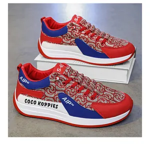 Stylish red and blue men's casual canvas sneakers featuring a unique patterned upper design
