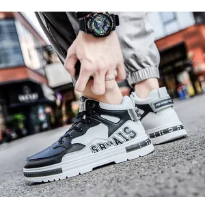 Close-up view of black and white mid-top sneakers featuring microfiber leather texture