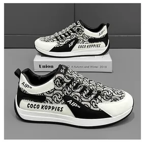 Close-up detail of designer canvas sneakers for men featuring black and white patterns