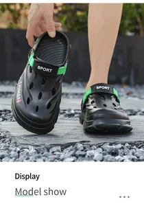 Close-up detail of men's outdoor clogs in black and neon green