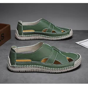 Detail view of breathable green leather sandals with hand-stitched seams and hollow-out design