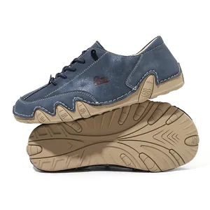 Detailed view of blue leather low-top casual shoes featuring a unique octopus tread sole.