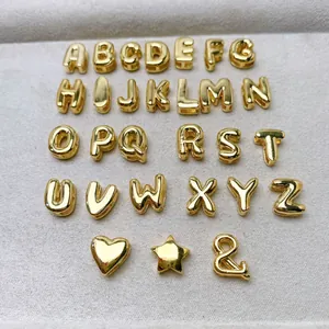 Complete set van 26 gouden mini alfabet hangers inclusief hartje en sterretje