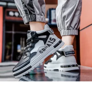 Detailed side view of black and white mid-top microfiber leather sneakers for men