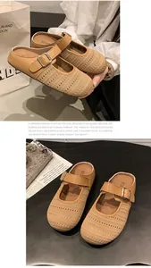 Detailed view of khaki mesh mules with adjustable buckled straps on a dark surface.