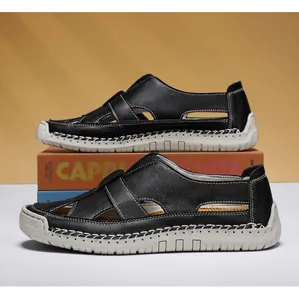 Detailed side profile of black hand-stitched casual hollow sandals with a white sole