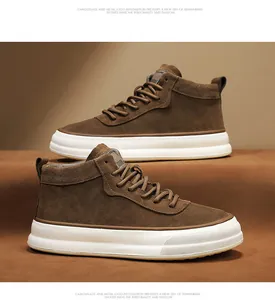 Detailed macro view of brown suede mid-top workwear sneakers with thick white soles