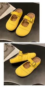 Side and top view of yellow mesh mule clogs with adjustable buckle strap