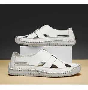 Detailed view of handmade stitching and breathable cut-outs on white summer sandals