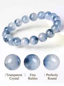 Macro view of blue rutilated quartz beads showing fine hair-like inclusions and clarity