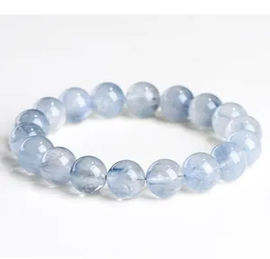 Close-up of natural blue rutilated quartz beaded bracelet with silk-like inclusions