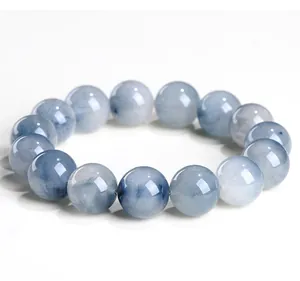 Close-up of natural blue rutilated quartz beads showing unique hair-like inclusions