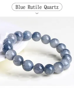 Detailed view of natural blue rutilated quartz beads with fine needle inclusions