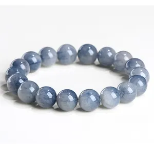Detailed close-up shot of a natural blue rabbit hair rutilated quartz beaded bracelet