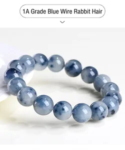 Close-up of natural blue rutilated quartz beaded bracelet with clear crystal texture.