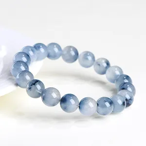 Natural blue rabbit hair rutilated quartz beaded bracelet on a clean white background.
