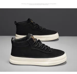 Close-up profile of black suede mid-top street style sneakers with chunky white platform soles.