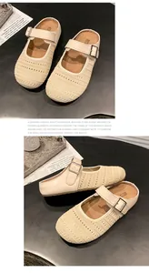 Stylish beige knit mules with thick sole and breathable mesh detail.