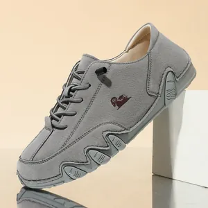 Stylish grey low-top casual shoes featuring unique octopus zigzag sole and ram logo detail