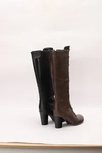 Side view of retro women's block heel knee high boots with decorative metal studs