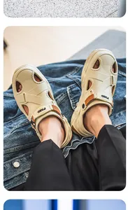 Close-up view of beige men's closed-toe casual beach sandals with PXED brand logo straps