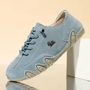 Macro shot of light blue suede low-top casual shoes featuring a unique wave-pattern sole