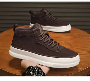 Close-up detail of premium brown suede mid-top casual sneakers with thick white soles