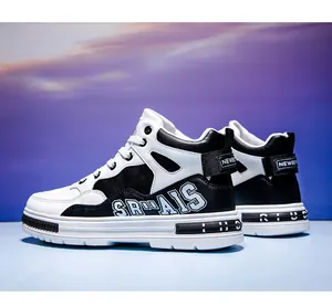 Close-up of stylish mid-top black and white sneakers with microfiber leather finish.
