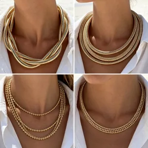 Set of 4 elegant gold metallic statement chokers with geometric design for women