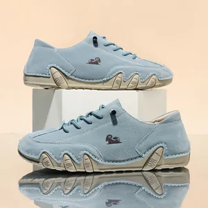 Macro view of blue casual shoes with unique octopus-inspired sole design and ram logo.