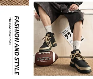 Stylish black high-top men's Martin boots with thick soles and khaki laces on a football