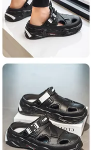 Macro view of black men's sport clogs featuring thick soles and adjustable buckle straps