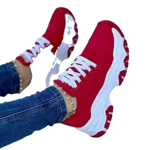 Comfortable women's red chunky sneakers with thick white soles and lace-up design for sports