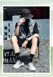 Street style photography of white breathable men's outdoor beach clogs with blue strap