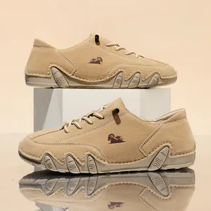 Detail view of khaki wide-fit casual shoes with a unique non-slip octopus sole design.