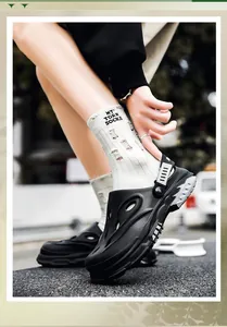 Detailed view of men's black breathable outdoor clogs featuring a stylish two-way strap design