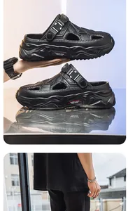 Detailed view of black men's beach sandals with thick soles and breathable design