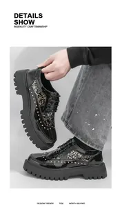 Detailed view of black patent leather men shoes featuring gold studs and leaf patterns