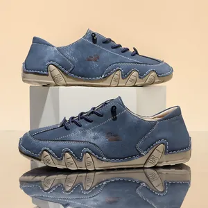 Detailed side view of blue men's casual shoes with unique octopus rubber sole