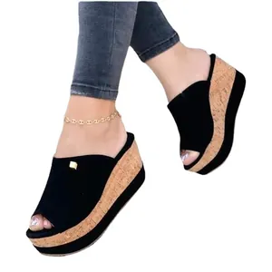 Stylish women's black peep-toe wedge platform sandals with a cork-textured thick sole