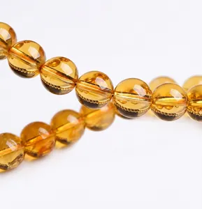 Macro view of a natural violent yellow crystal bracelet showing high transparency